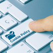 A finger shown pressing a button on a keyboard that says &quot;Cookie Policy.&quot;